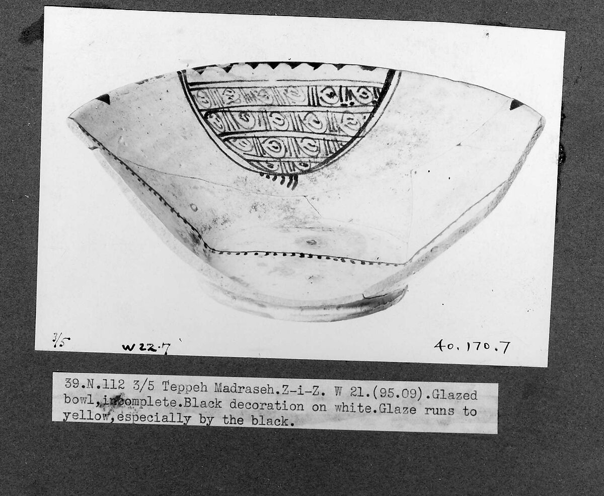 Bowl, Earthenware; white slip, black decoration tinges the glaze yellow