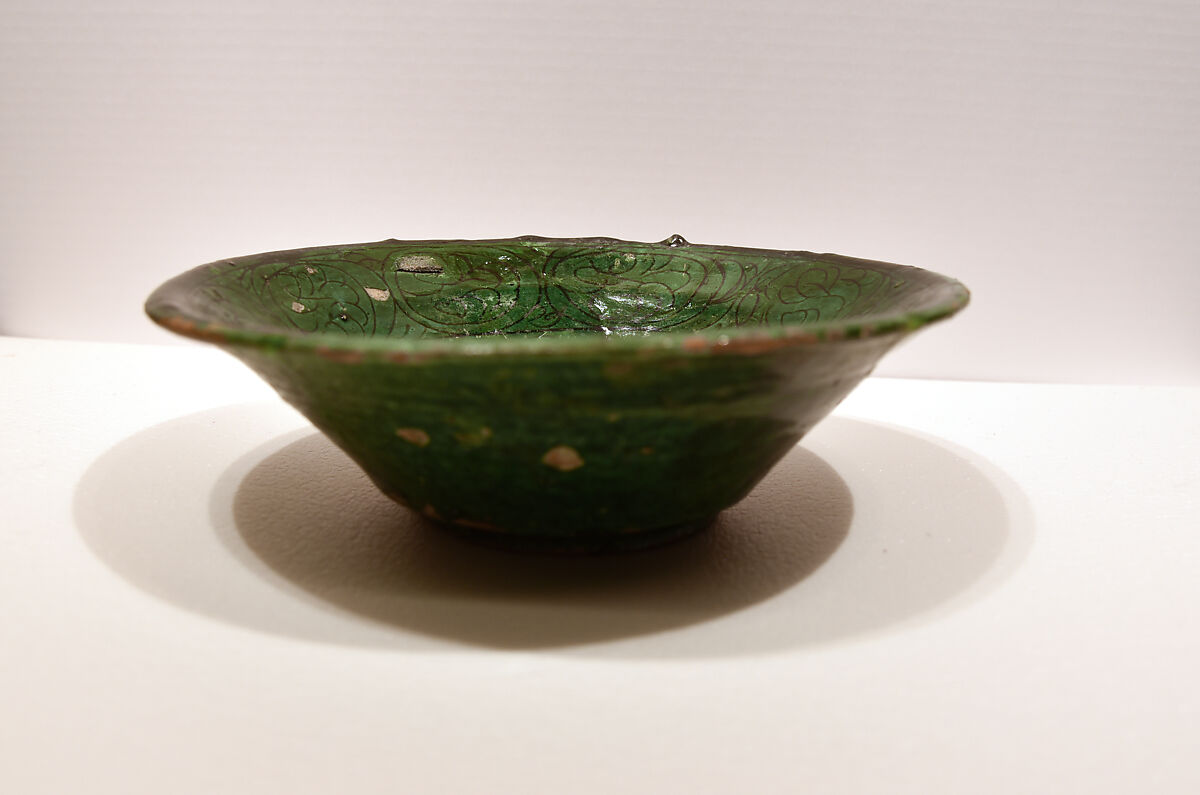 Bowl, Earthenware; white slip, incised under dark green glaze 