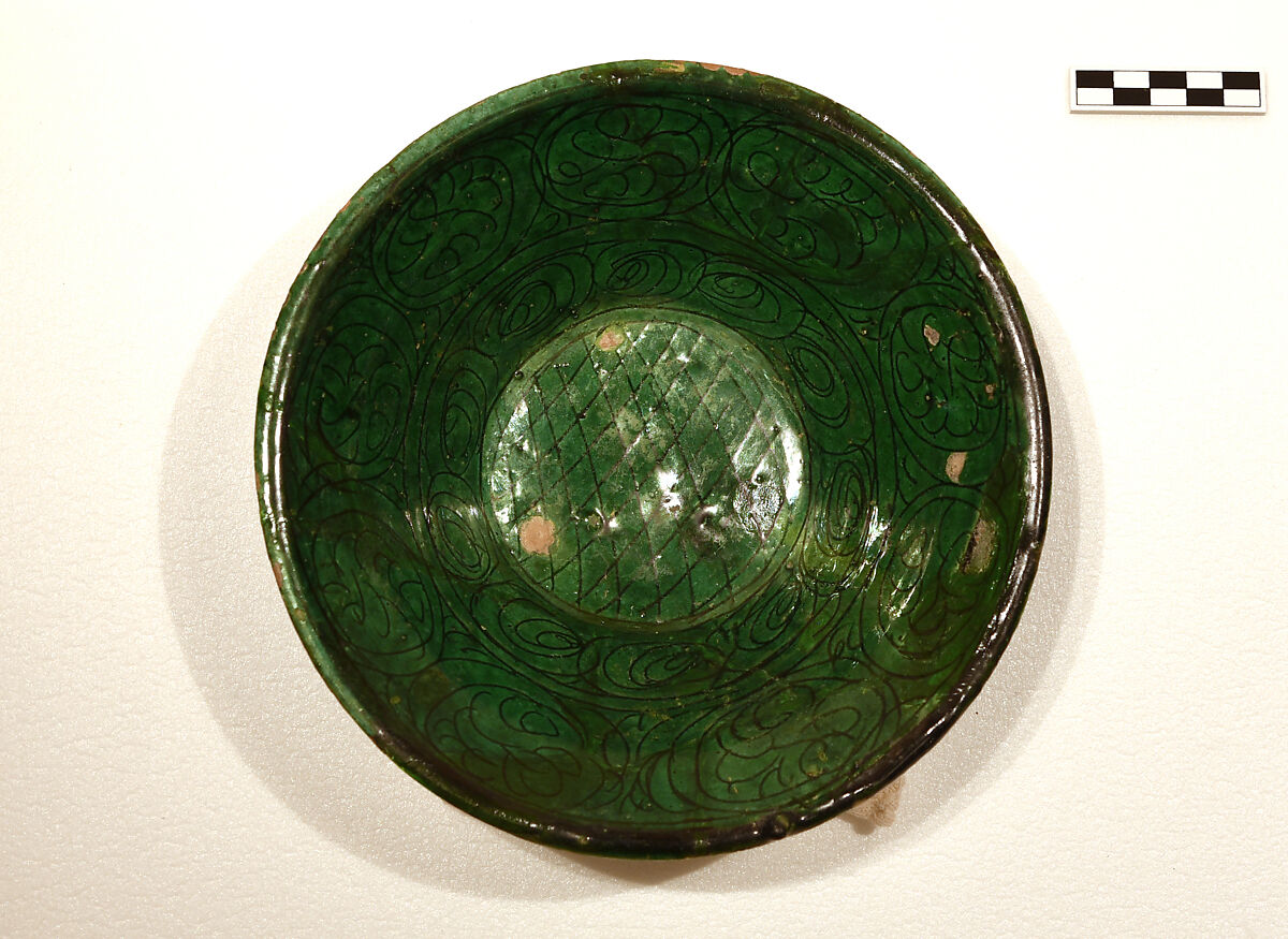 Bowl, Earthenware; white slip, incised under dark green glaze