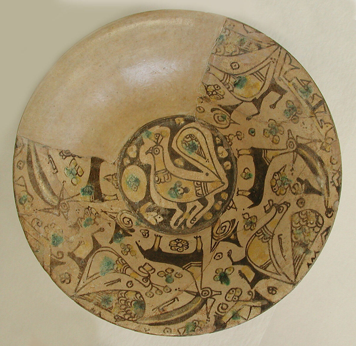 Bowl, Earthenware; painted in black slip and polychrome pigments under transparent colorless glaze (buff ware) 
