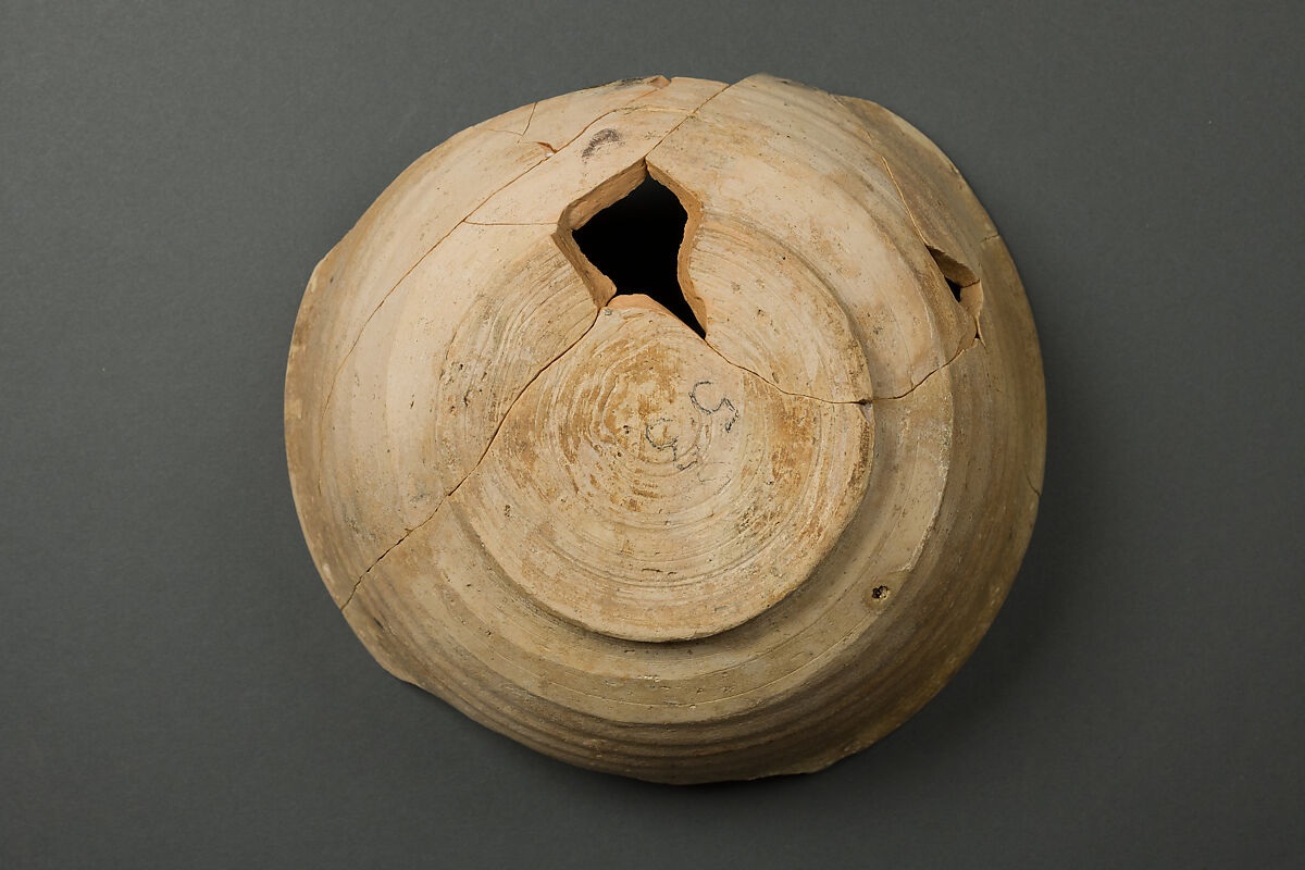 Bowl, Earthenware; buff slip, with polychrome slip decoration under transparent glaze