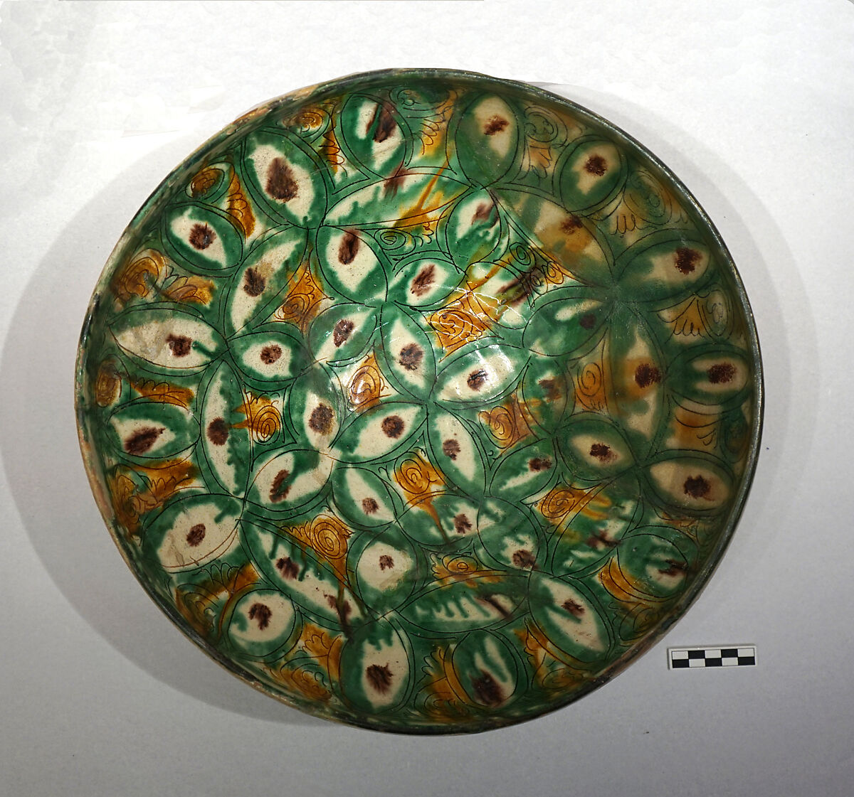 Bowl, Earthenware; white slip, incised and splashed with polychrome glazes under transparent glaze (sgraffito ware) 