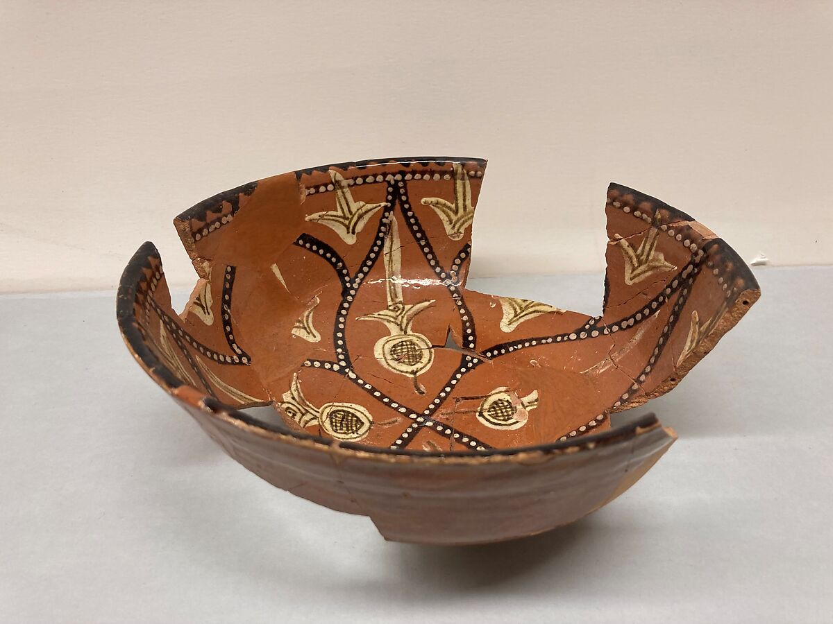 Bowl, Earthenware; reddish brown slip, polychrome slip decoration under glaze