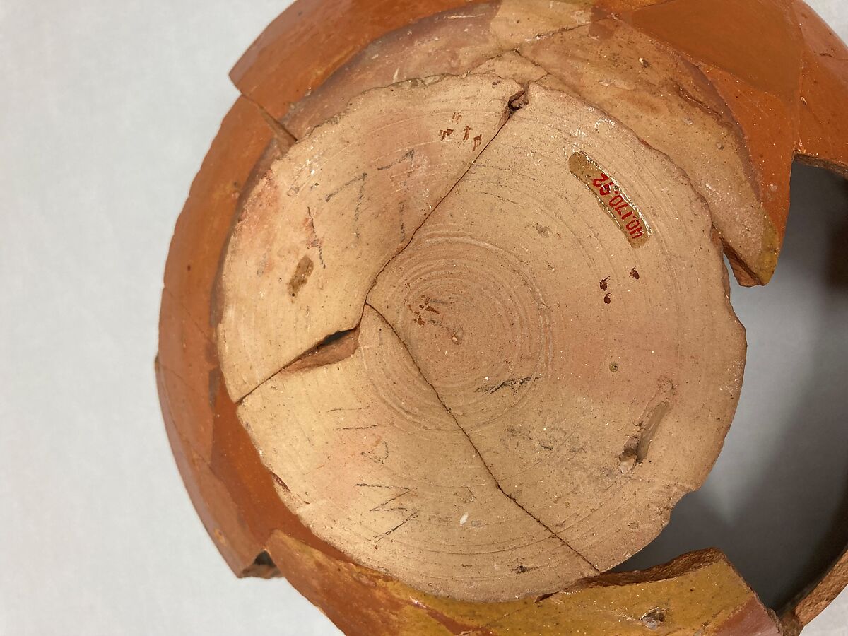 Bowl, Earthenware; reddish brown slip, polychrome slip decoration under glaze