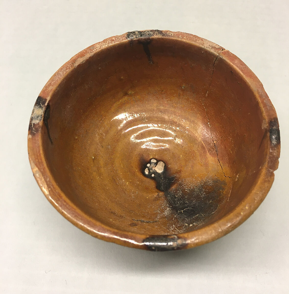 Bowl, Earthenware; red slip, brown glaze 