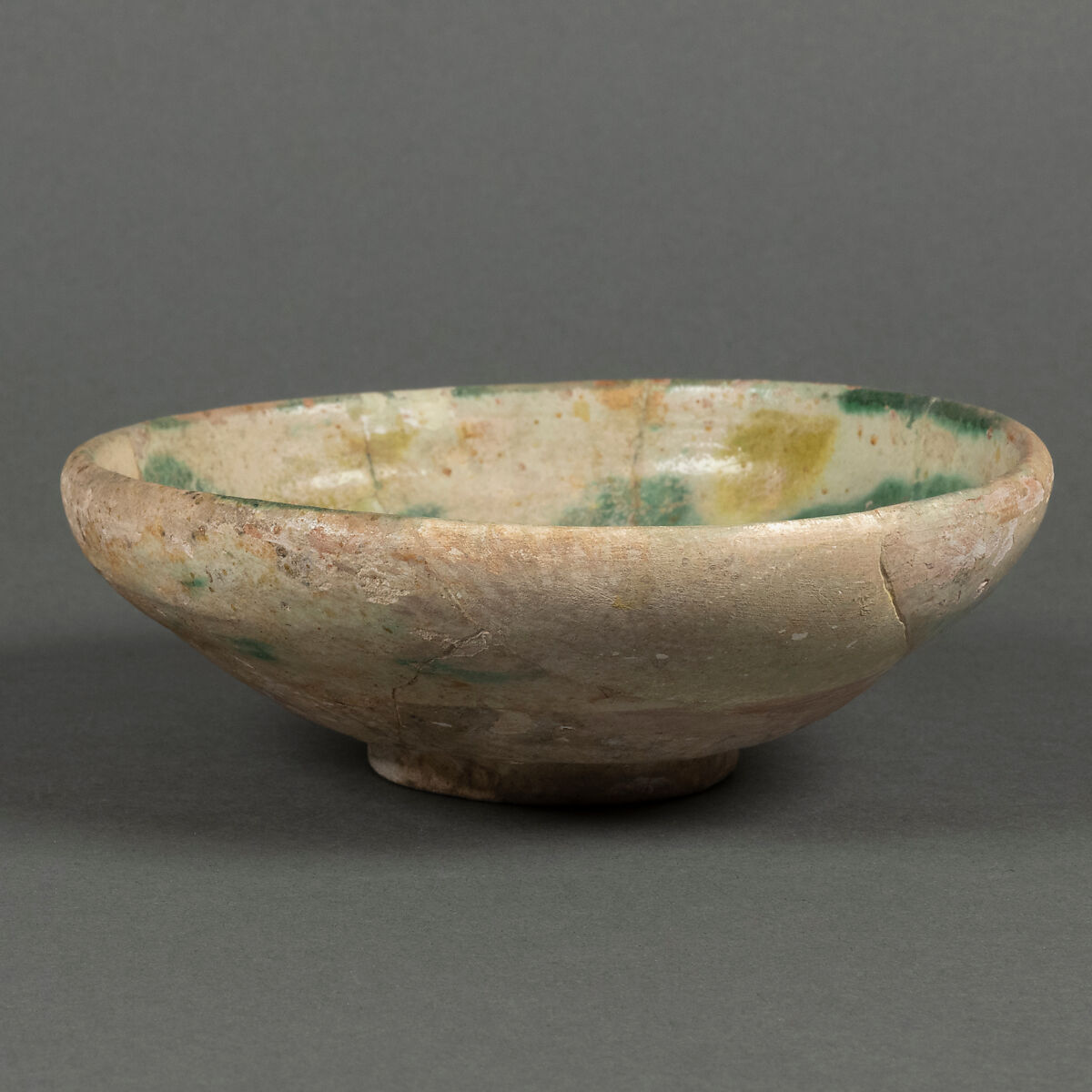 Bowl, Earthenware; white slip with polychrome slip decoration under transparent glaze 