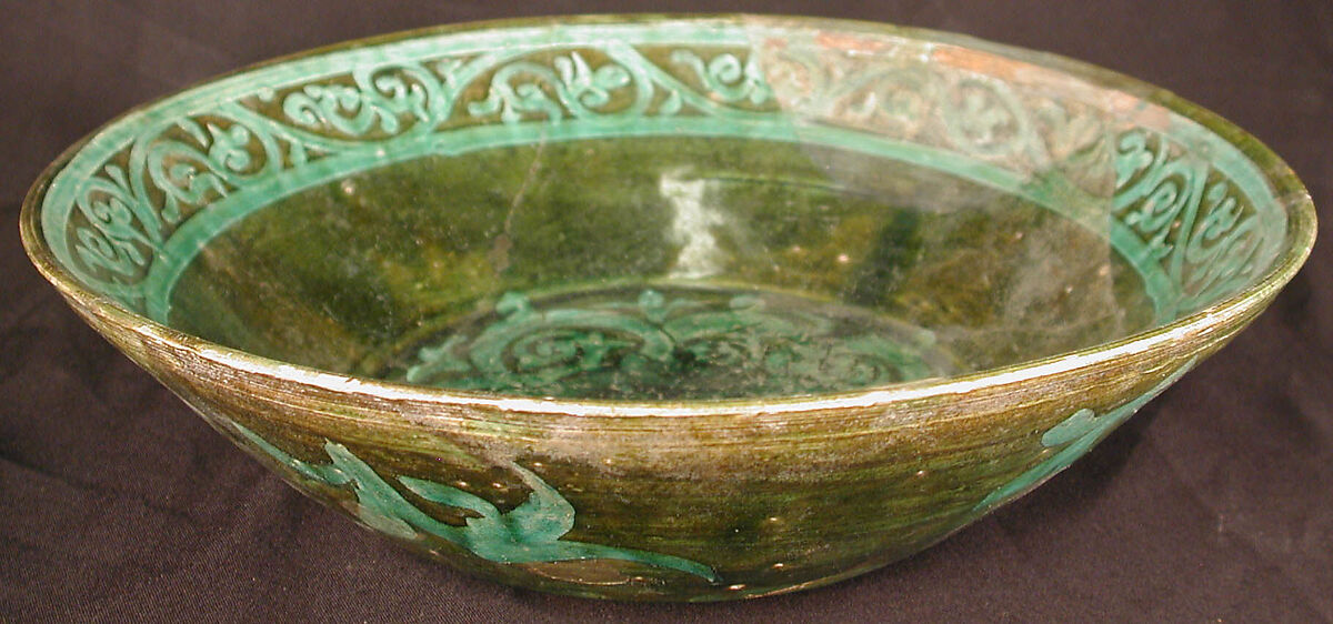Bowl, Earthenware; purplish red slip, white slip decoration under green glaze 