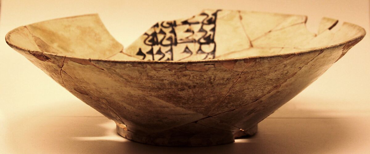 Bowl, Earthenware; white slip, brown-black slip decoration, greenish glaze 