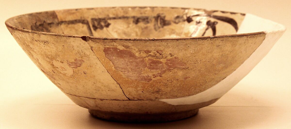 Bowl, Earthenware; white slip, decoration in purplish black, glazed