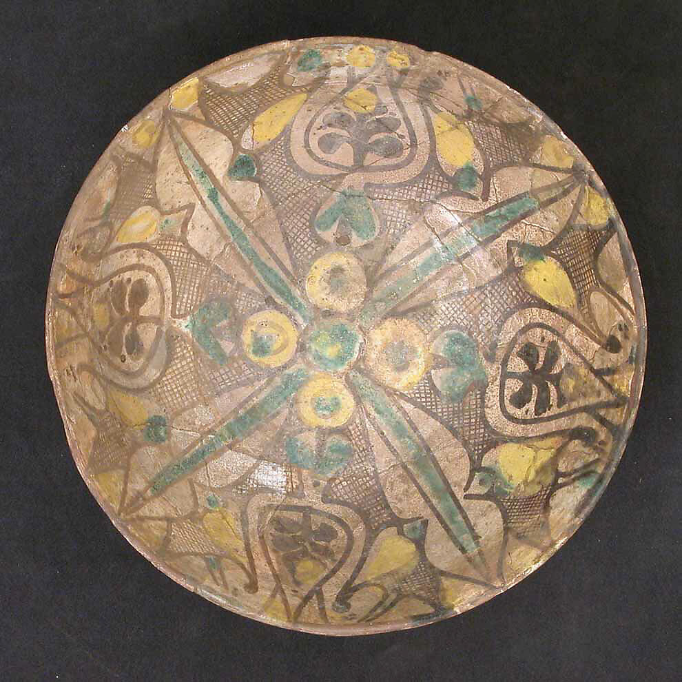 Bowl, Earthenware; buff slip, decoration in black with touches of green and yellow, glazed 