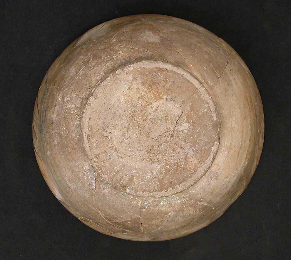Bowl, Earthenware; buff slip, decoration in black with touches of green and yellow, glazed