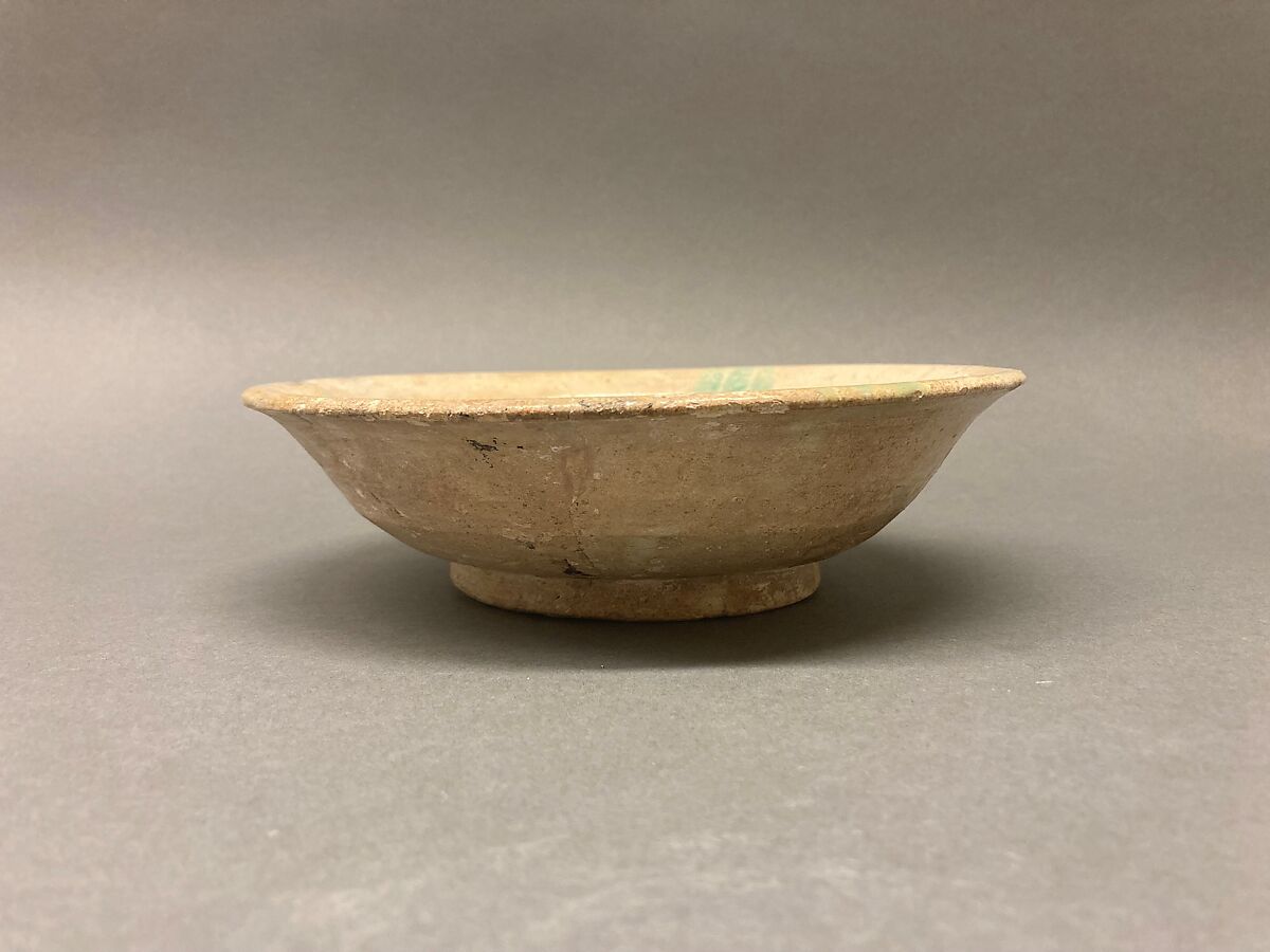 Bowl, Earthenware; buff slip, white glaze, brown-black decoration