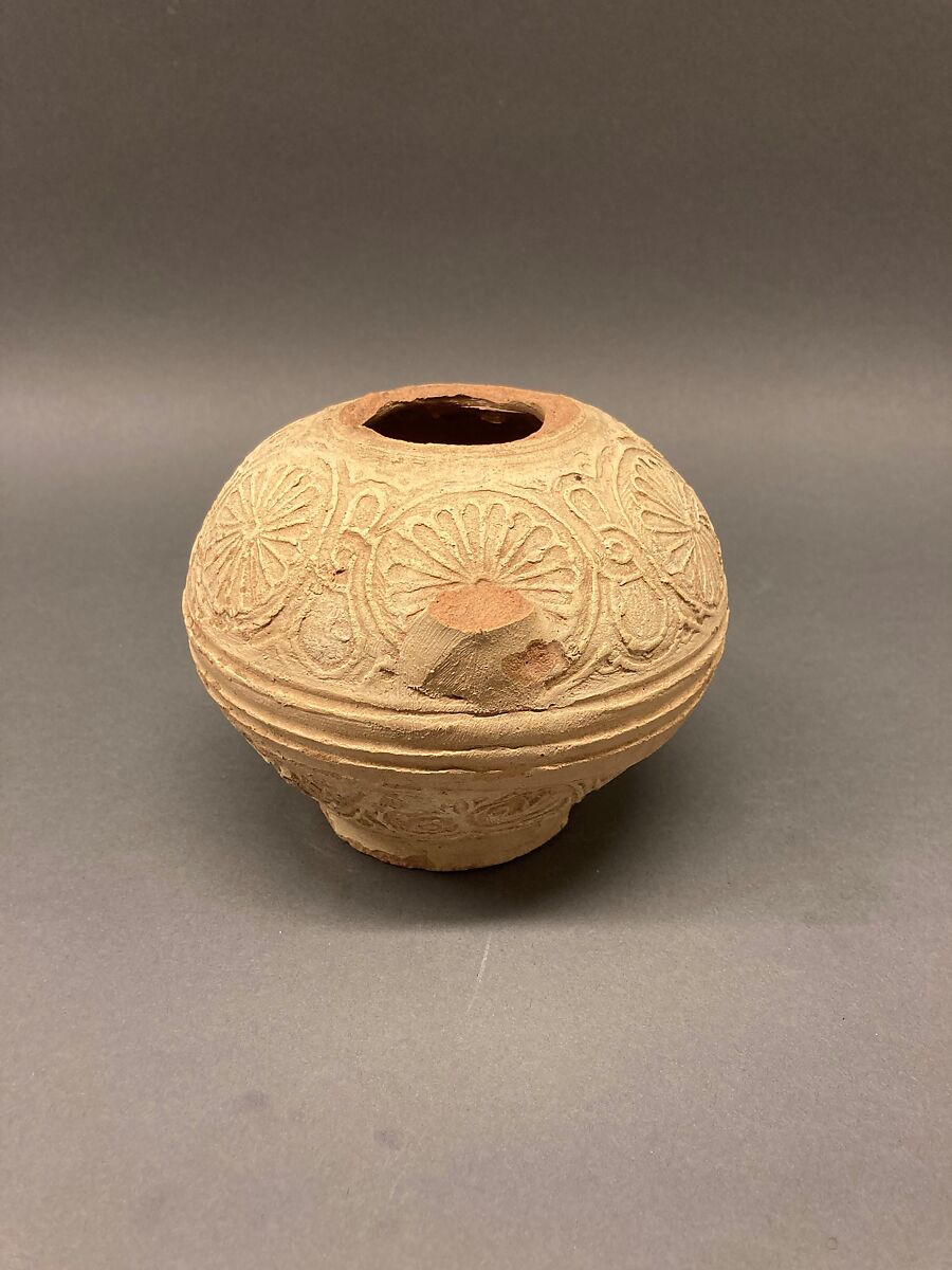 Fragment of an Ewer, Earthenware; molded decoration and unglazed 