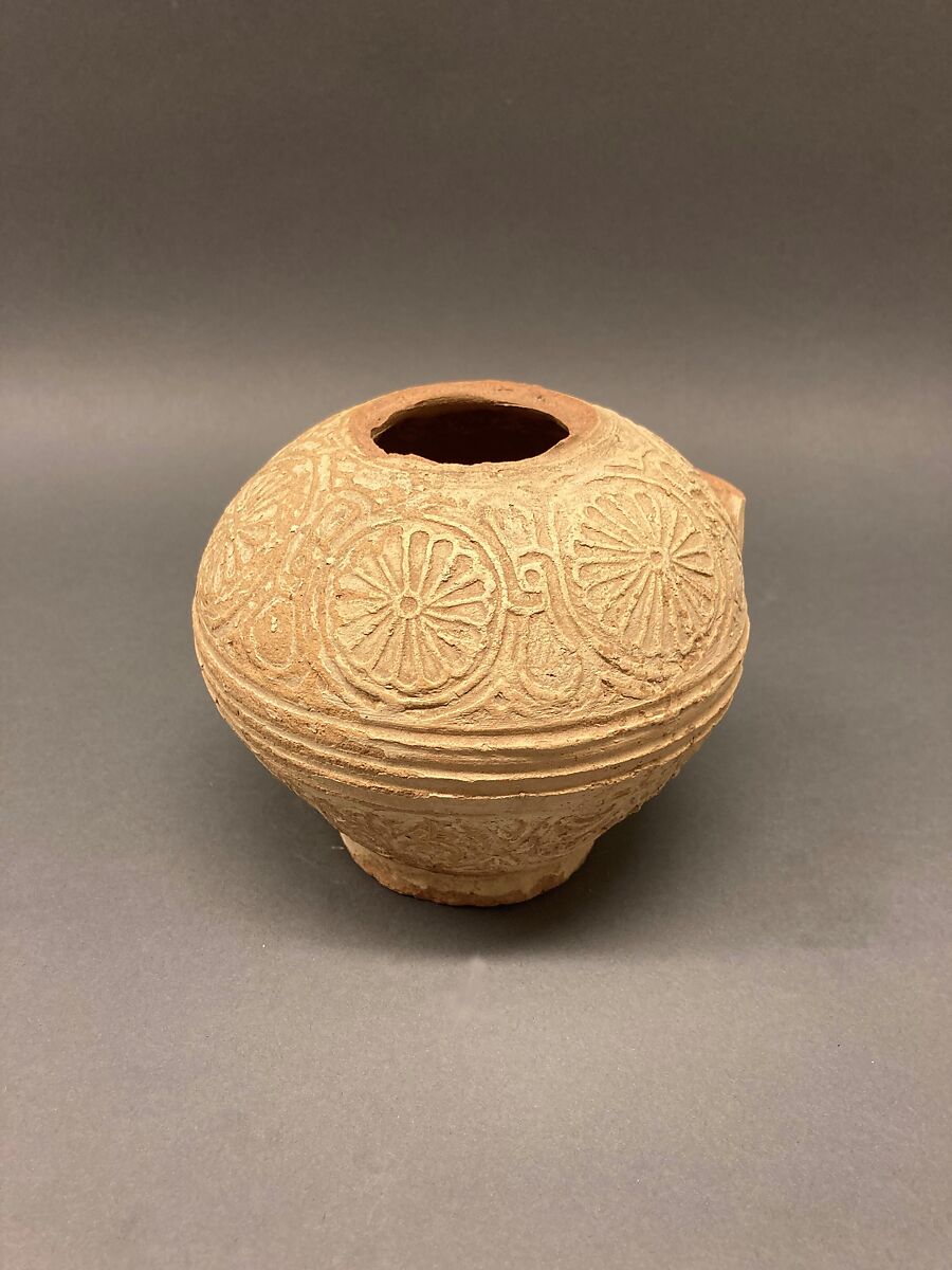 Fragment of an Ewer, Earthenware; molded decoration and unglazed