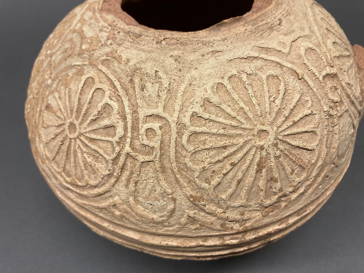 Fragment of an Ewer, Earthenware; molded decoration and unglazed