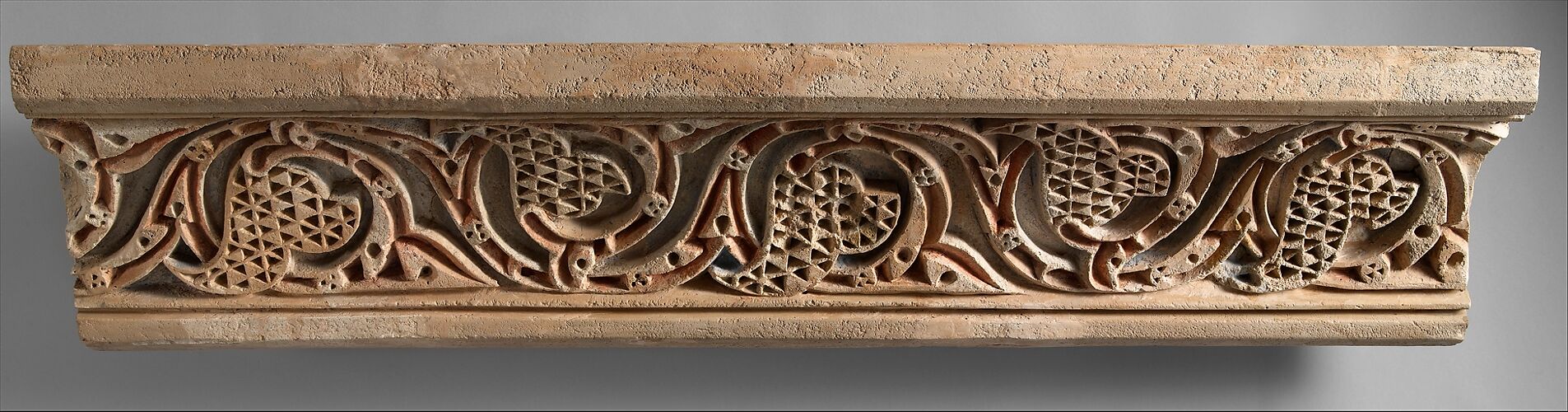 Fragment of a Painted Cornice Panel with Scrolling Vines