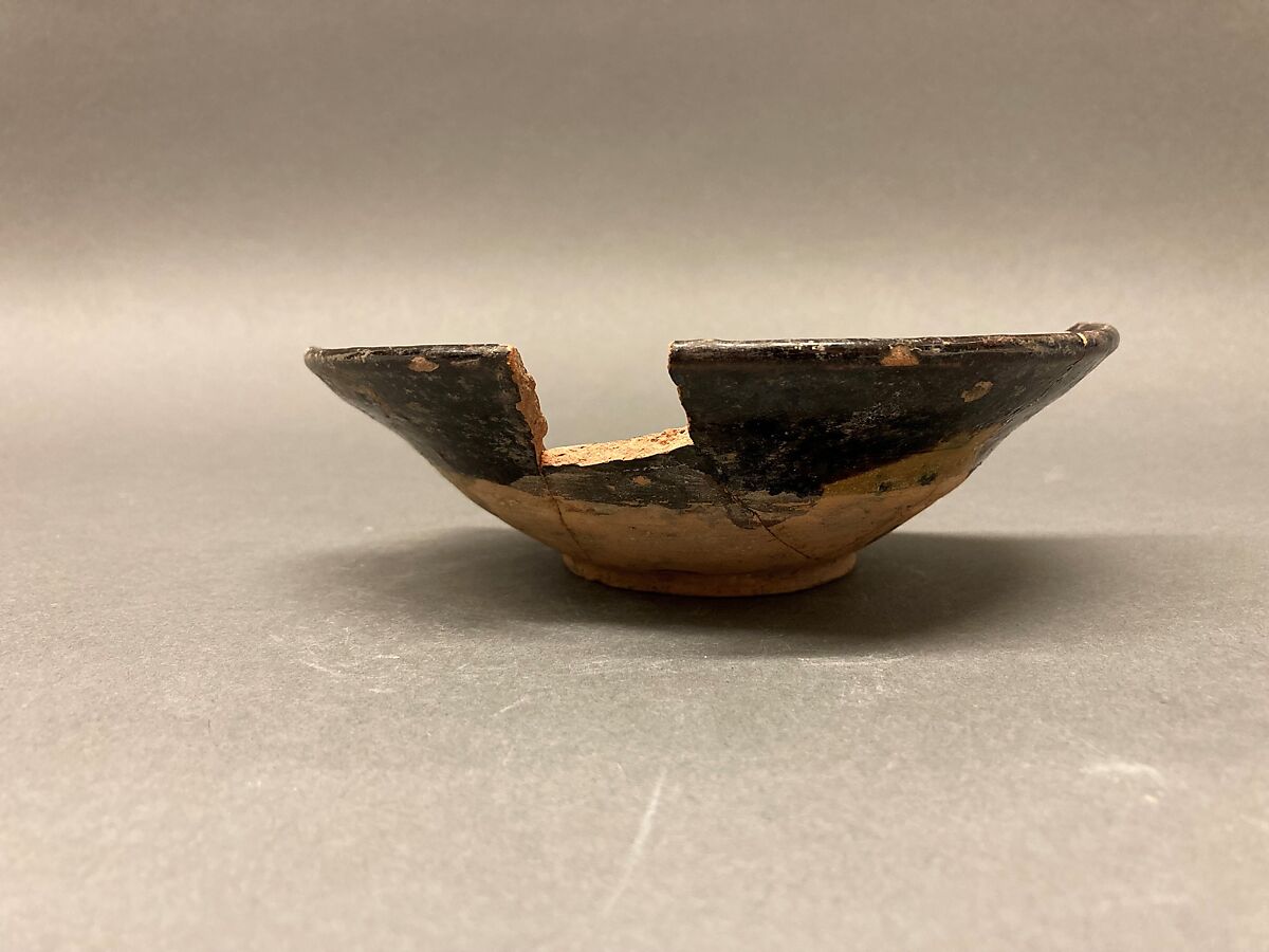 Bowl, Earthenware; reddish body, purplish slip, white slip decoration under greenish glaze