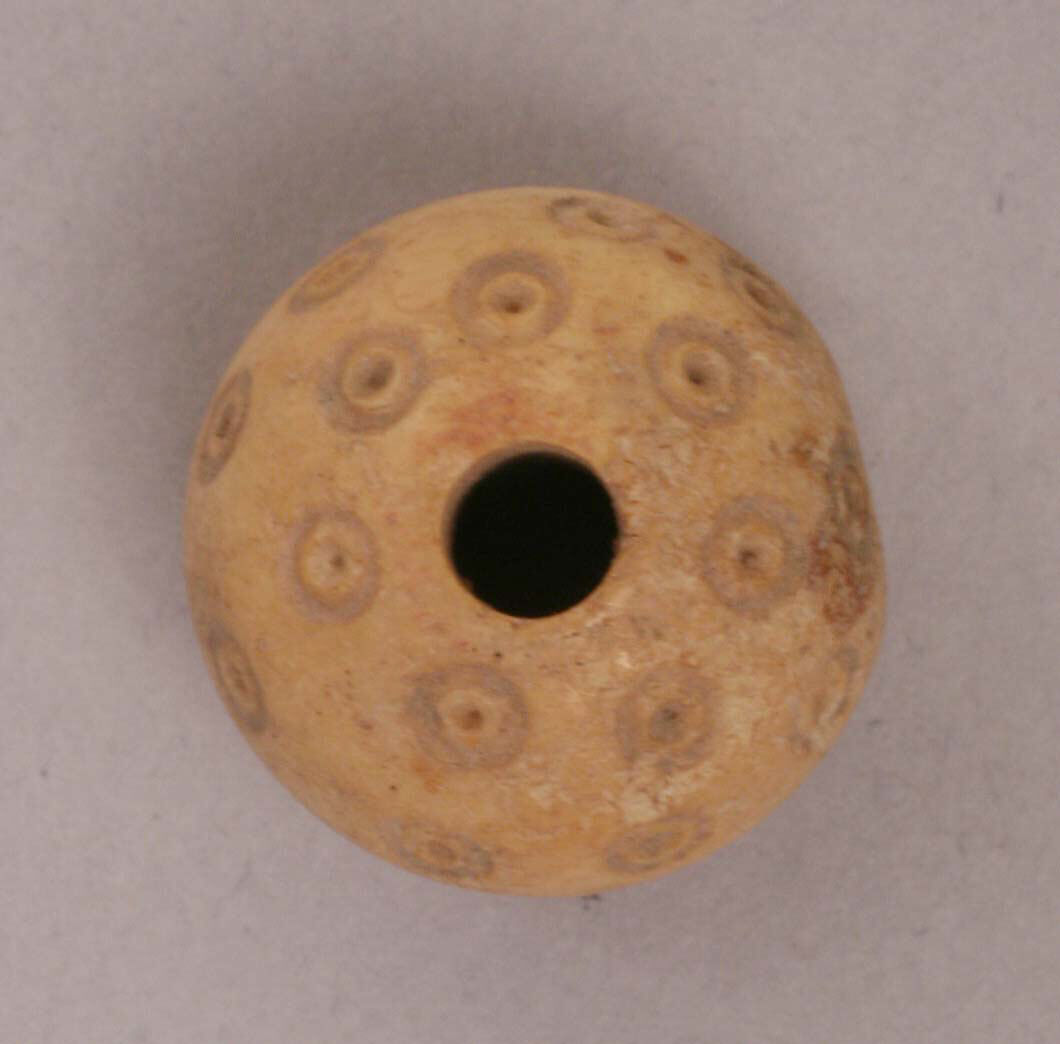 Button or Bead, Bone; tinted, incised, and inlaid with paint 