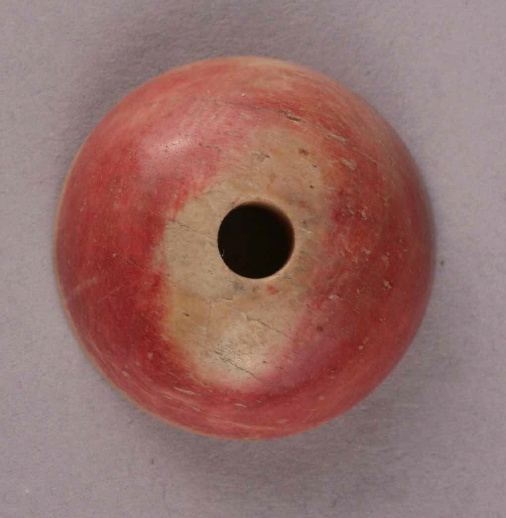Spindle Whorl, Bone; tinted, incised, and inlaid with paint 