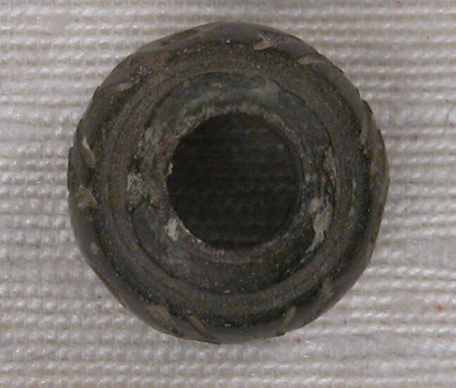 Button or Bead or Spindle Whorl, Stone; carved and incised
