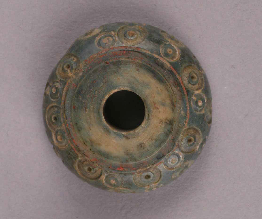 Spindle Whorl, Bone; tinted, incised, and inlaid with paint 