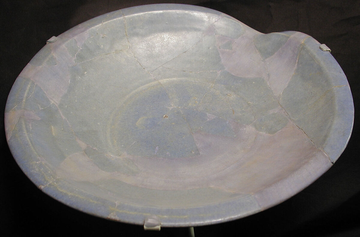 Plate, Earthenware; bluish glaze over grayish gritty body 