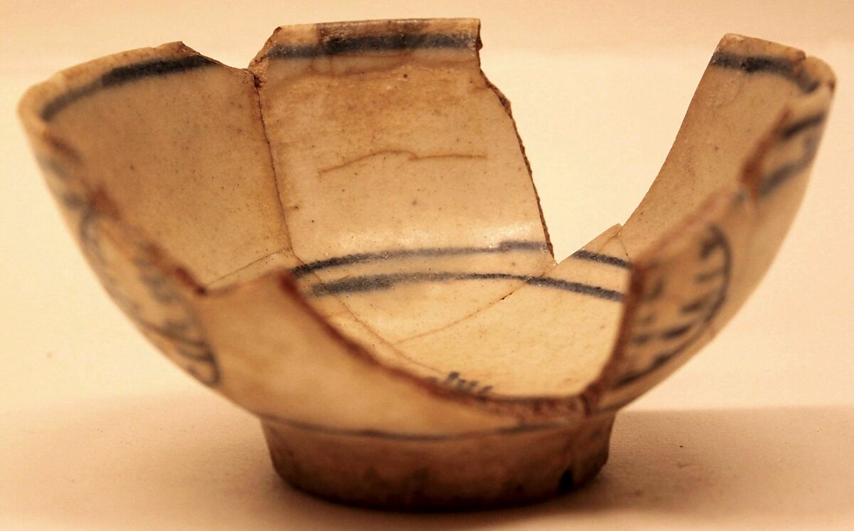 Bowl, Earthenware; gritty body, decoration in blue on white ground under glaze