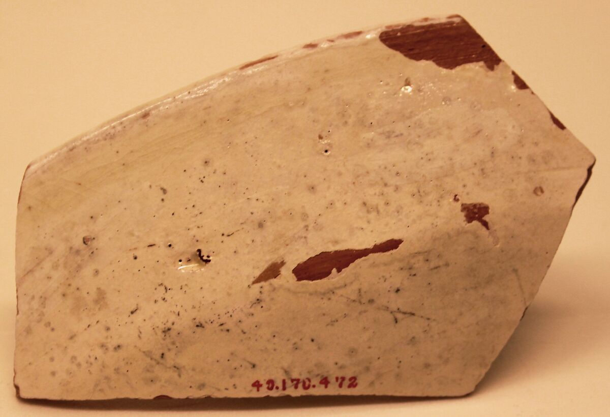 Ceramic Fragment, Earthenware; white slip, purplish-black and red decoration, glazed