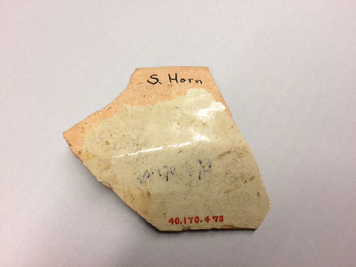 Ceramic Fragment, Earthenware; white slip, purplish-black and red decoration, glazed