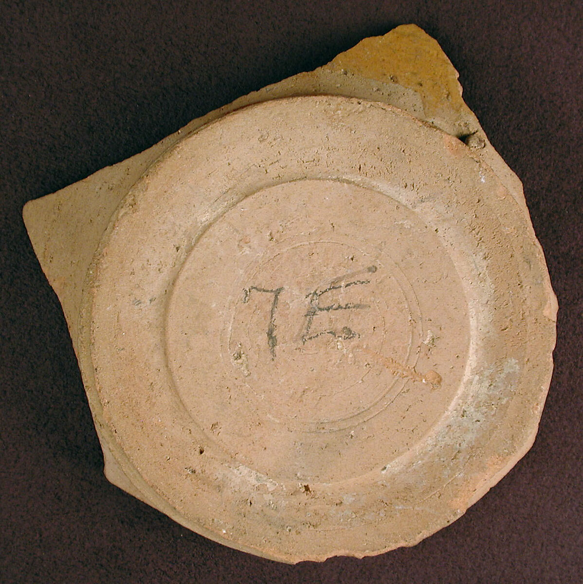 Base of a Vessel with a White Slip Inscription, Earthenware; red slip with polychrome slip decoration under transparent glaze