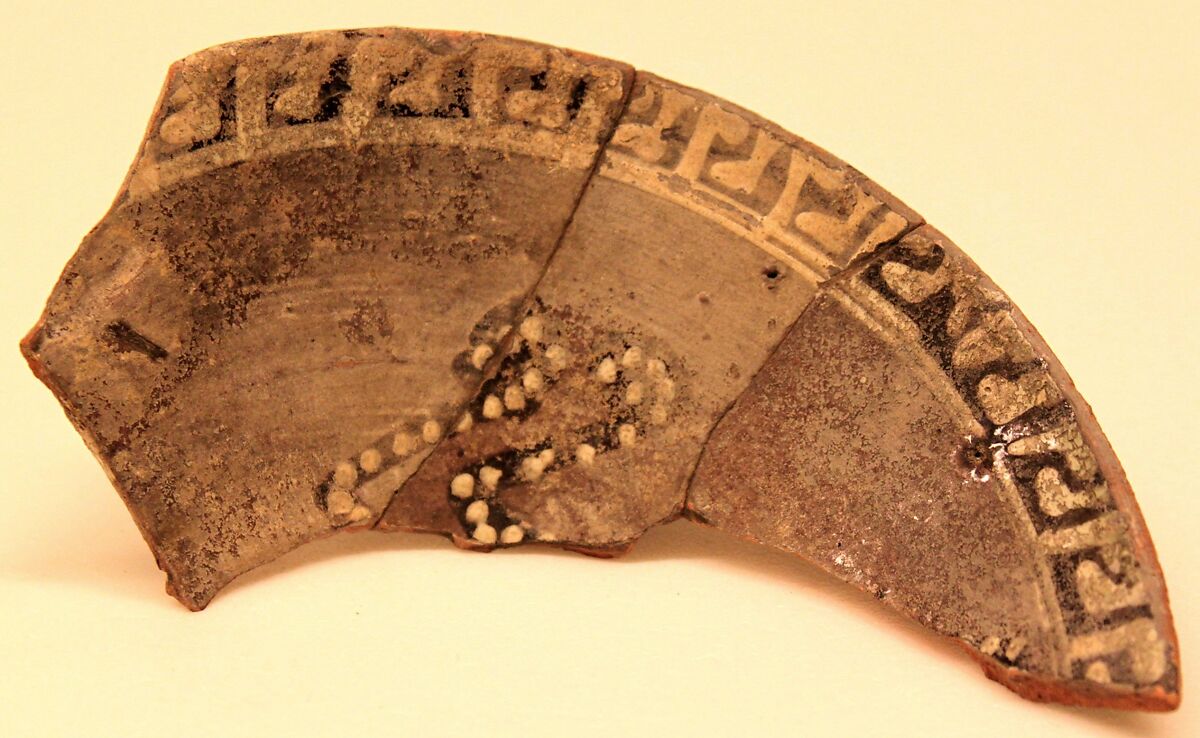 Ceramic Fragment, Earthenware; purplish slip, white decoration on black underglaze painting 
