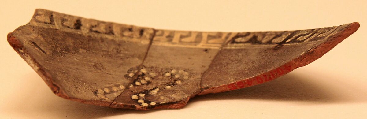 Ceramic Fragment, Earthenware; purplish slip, white decoration on black underglaze painting