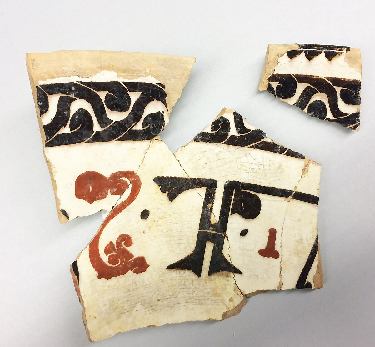 Fragments, Earthenware; fine white slip, decoration in red and black and sgraffito under glaze 