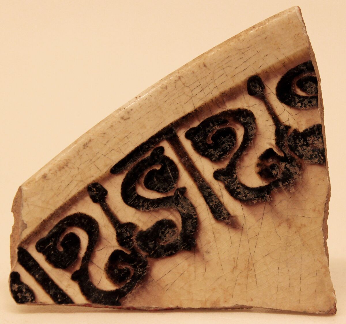 Fragment of a Bowl, Earthenware; white slip, purplish-black decoration under glaze 