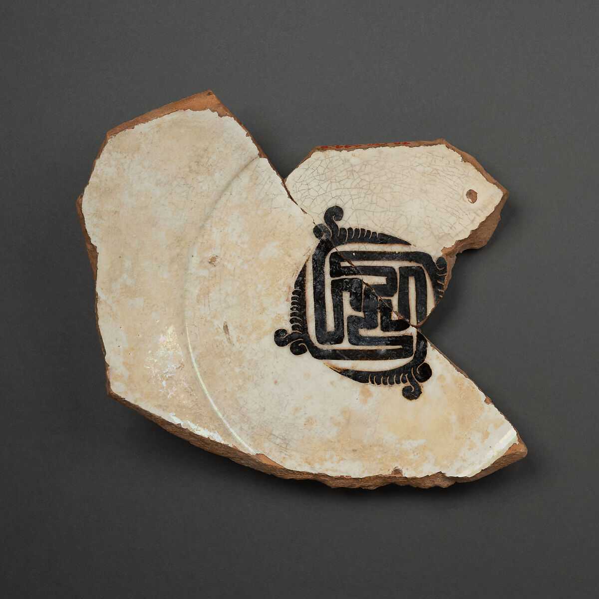 Fragment of a Bowl, Earthenware; white slip, black decoration 