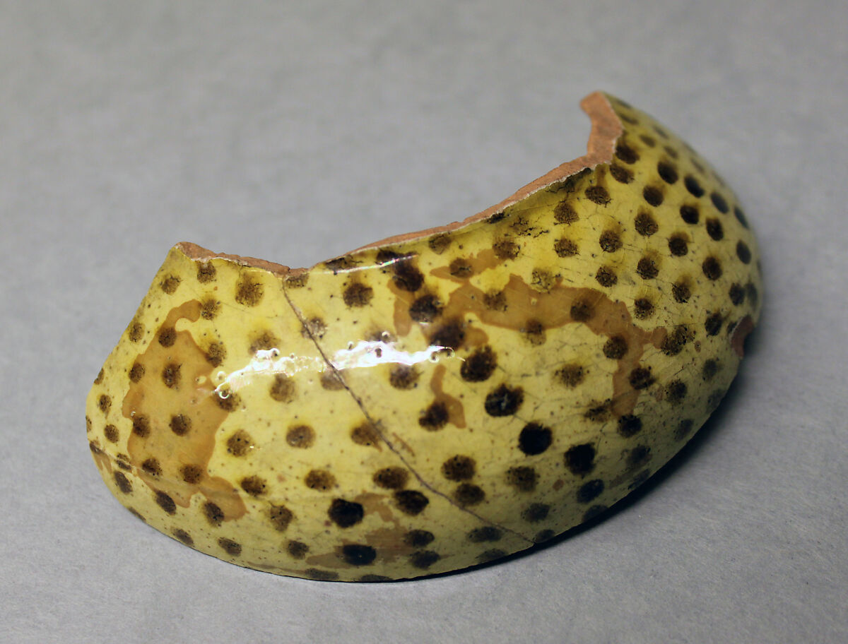Fragment of a Jar, Earthenware; reddish body, white slip and yellow-black decoration under glaze 