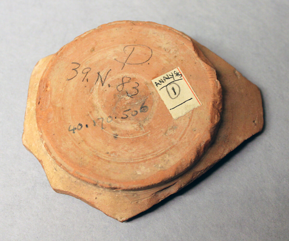 Fragment of a Bowl, Earthenware; white slip, yellow glaze, purplish black and green decoration