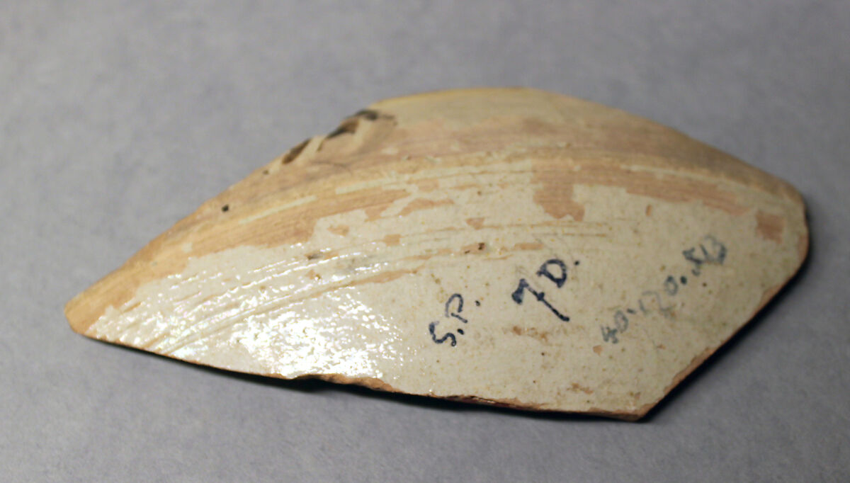 Fragment of a Bowl, Earthenware; reddish body, white slip with yellow-black and brown-black decoration under glaze