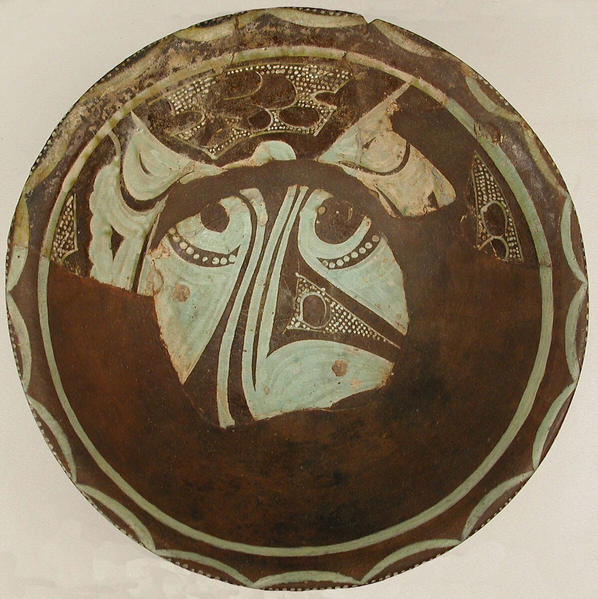 Bowl, Earthenware; purplish slip and white slip decoration under transparent glaze 