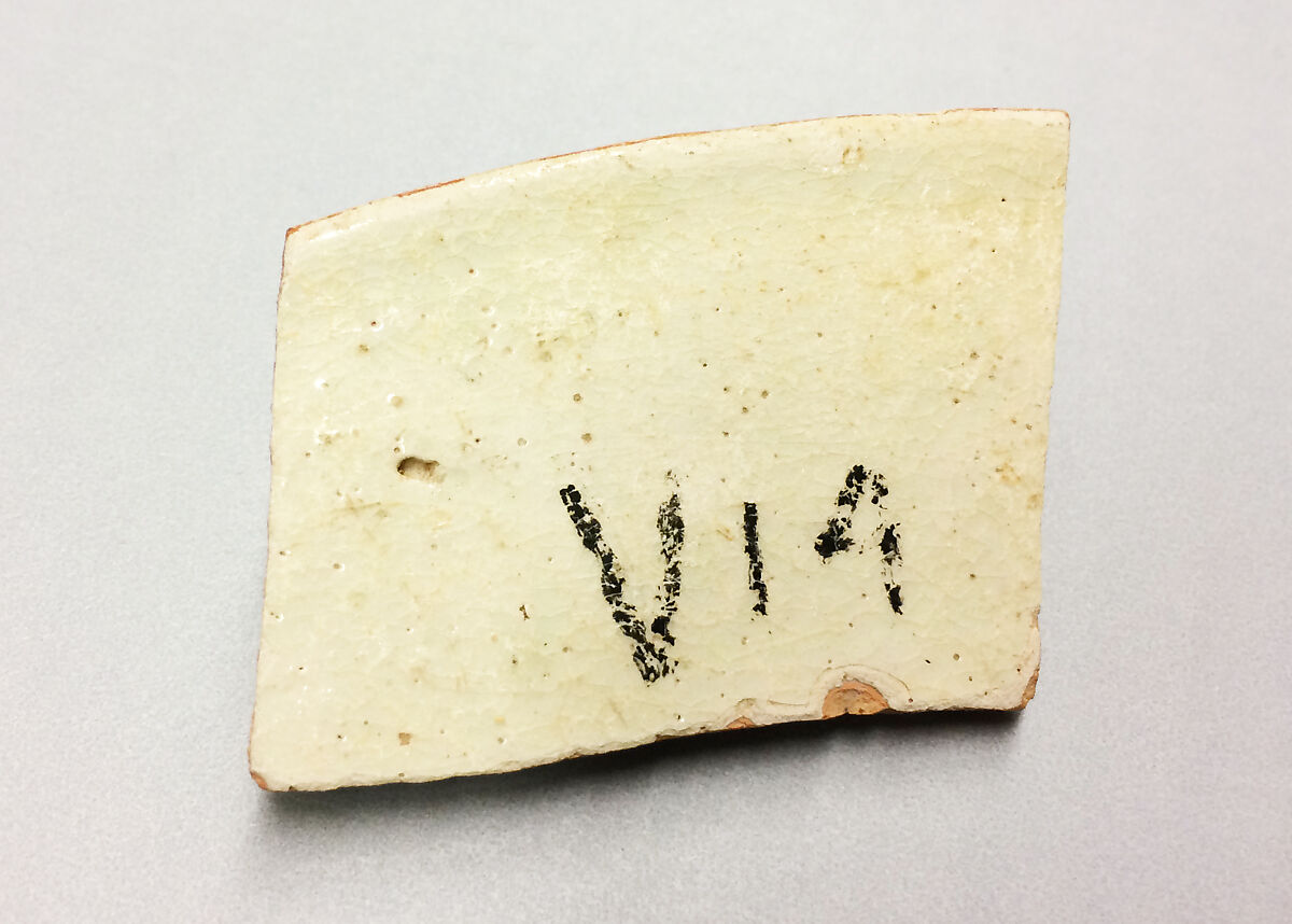 Ceramic Fragment, Earthenware; buff body, white slip, underglaze painted in red and green