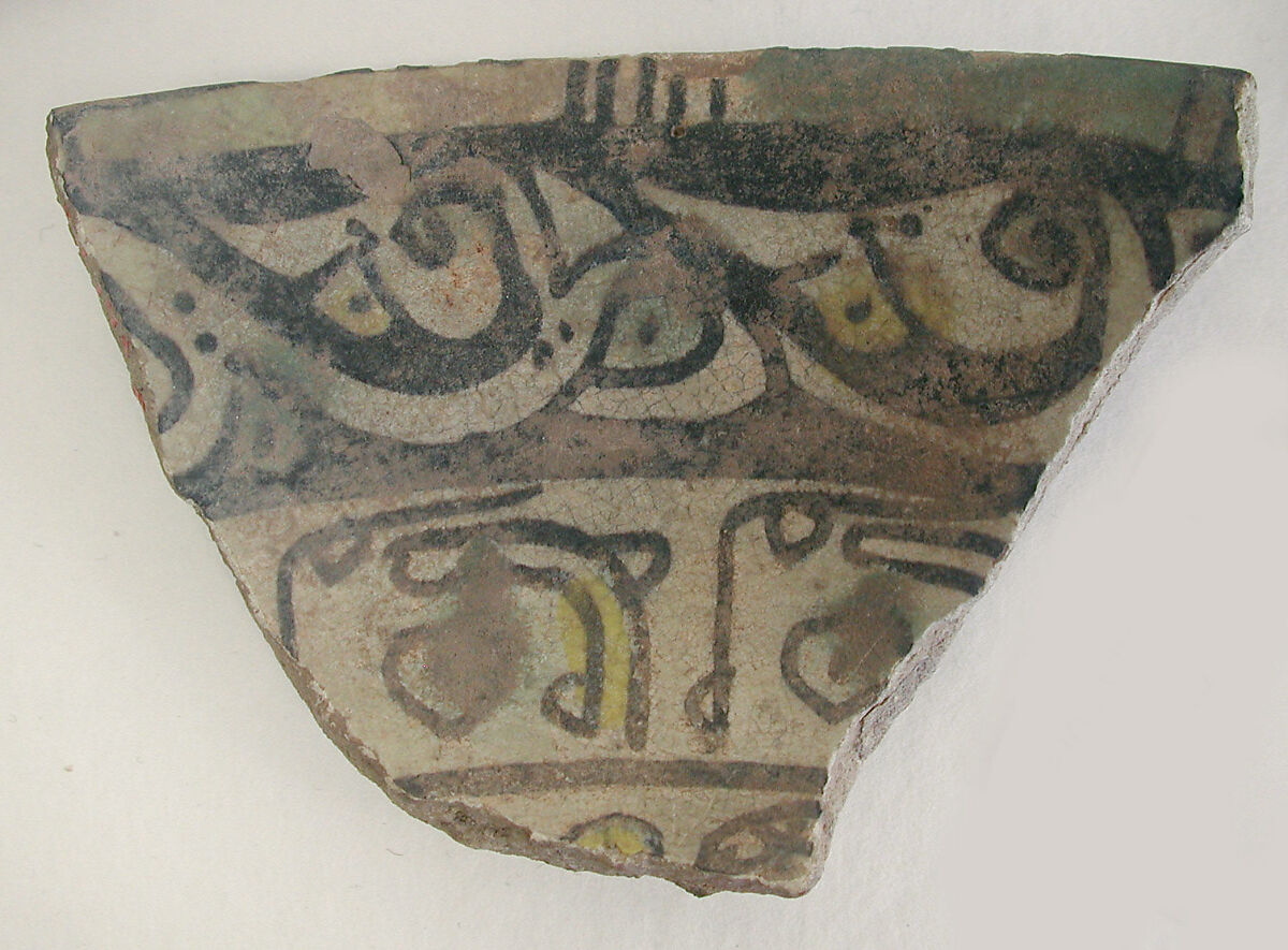 Fragment of a Bowl, Earthenware; painted in black slip and polychrome pigments under transparent colorless glaze (buff ware) 