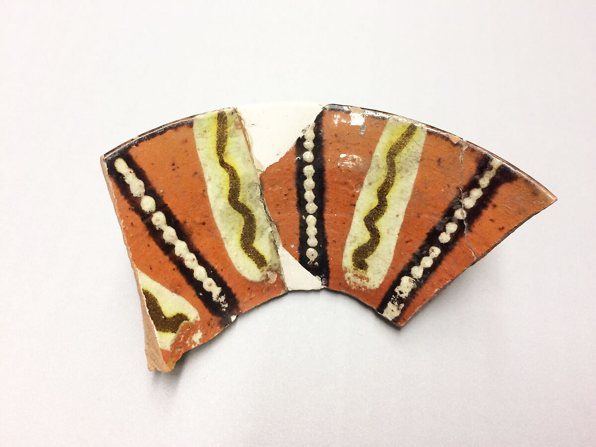 Fragment of a Bowl, Earthenware; reddish body, red slip, polychrome slip decoration under glaze 