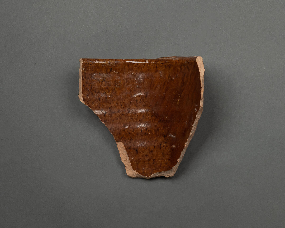 Fragment of a Vase, Earthenware; reddish body under brown glaze 