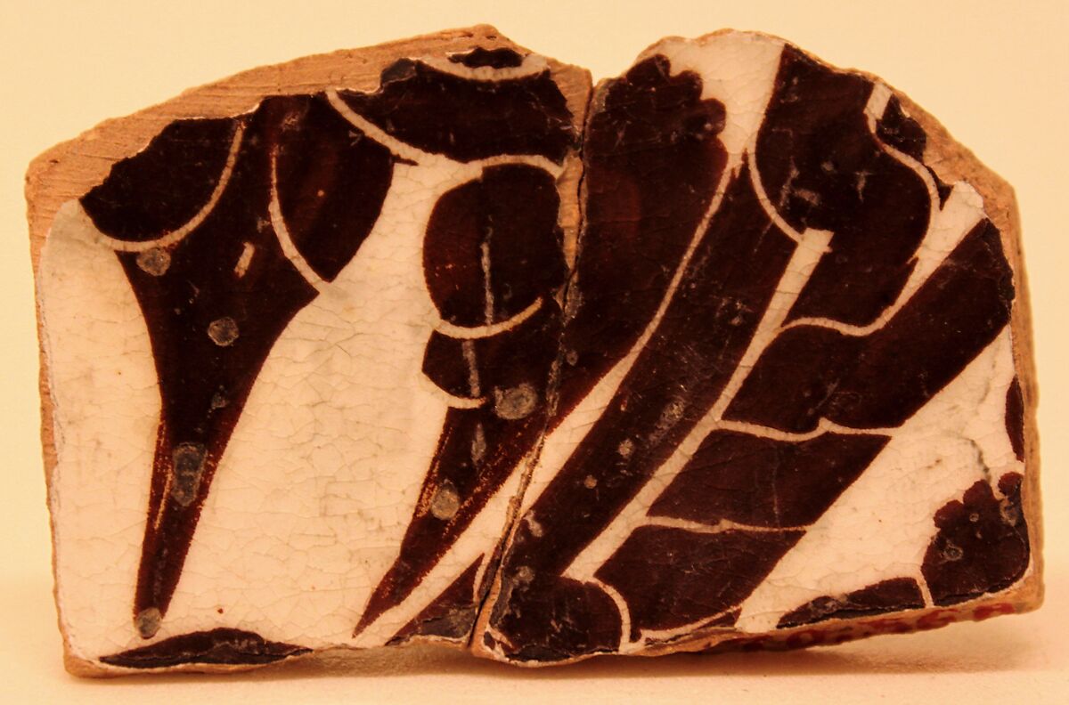 Fragment of a Bowl, Earthenware; buff body, white slip, dark brown slip decoration, sgraffito decoration under glaze 