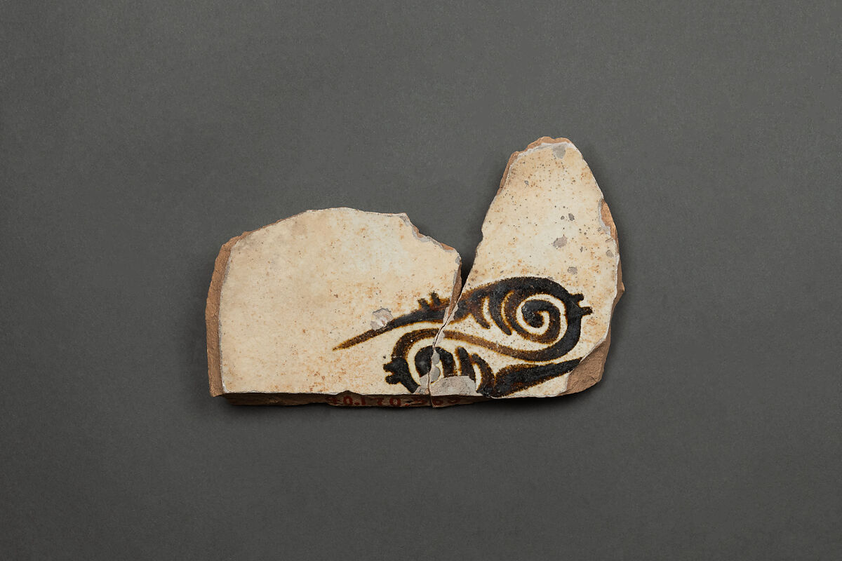 Fragment of a Bowl, Earthenware; reddish buff body, white slip, brown-black slip decoration under glaze 