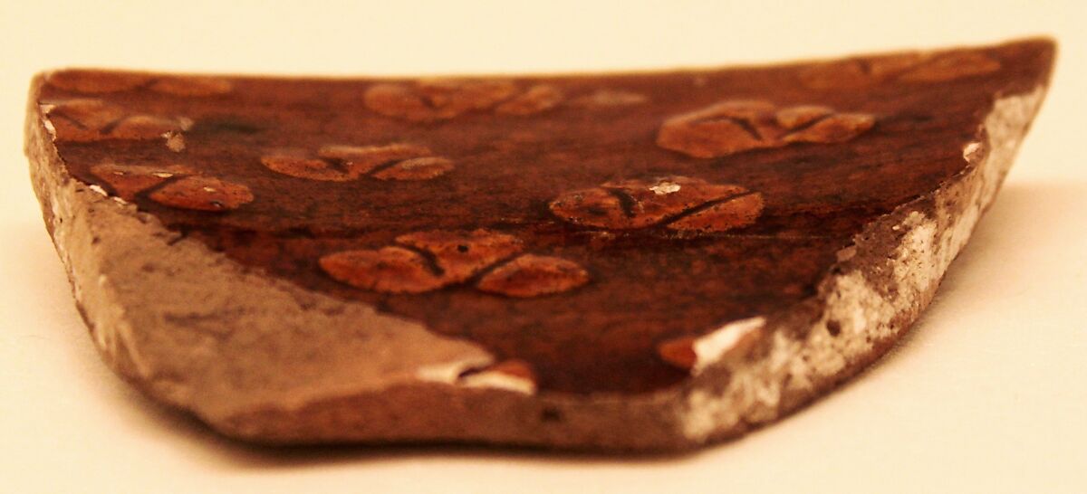 Fragment of a Bowl, Earthenware; gritty reddish body, white slip, sgraffito decoration under brownish yellow glaze