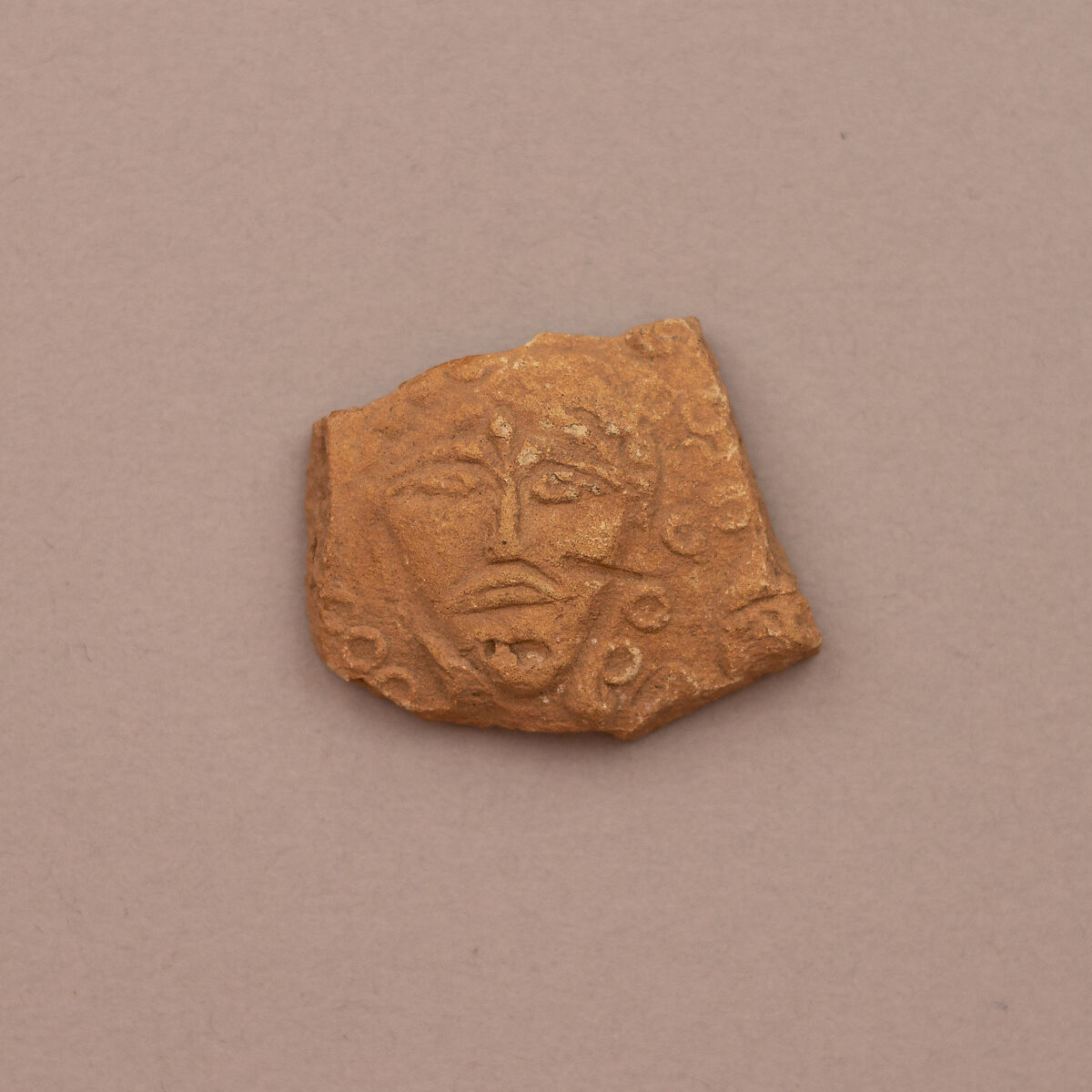 Ceramic Fragment, Earthenware; molded and unglazed 