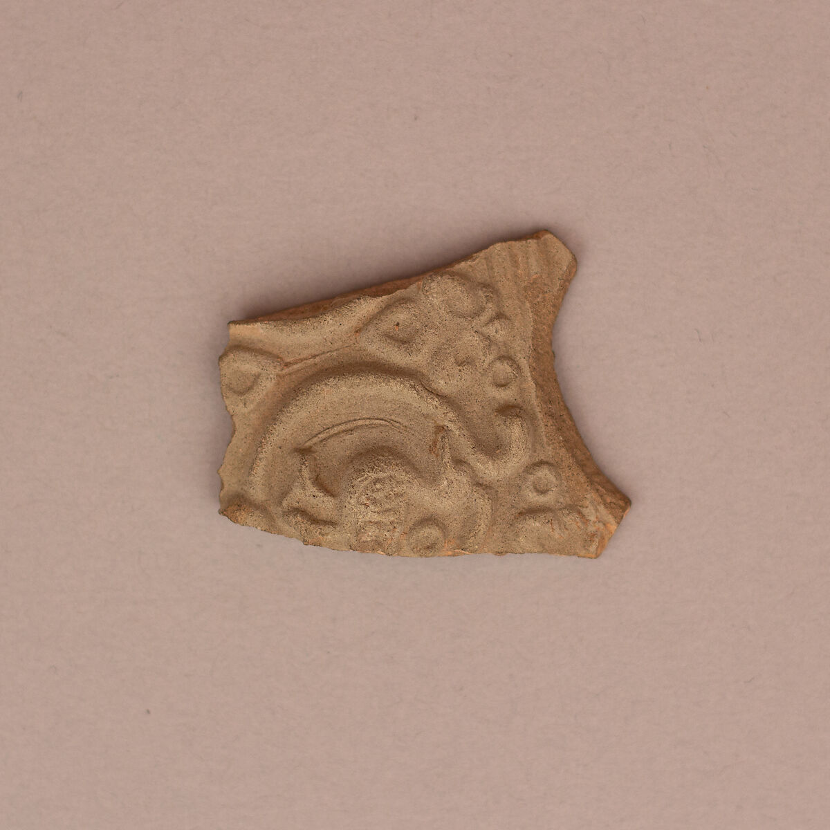 Fragment, Earthenware; slip covered and molded, unglazed 