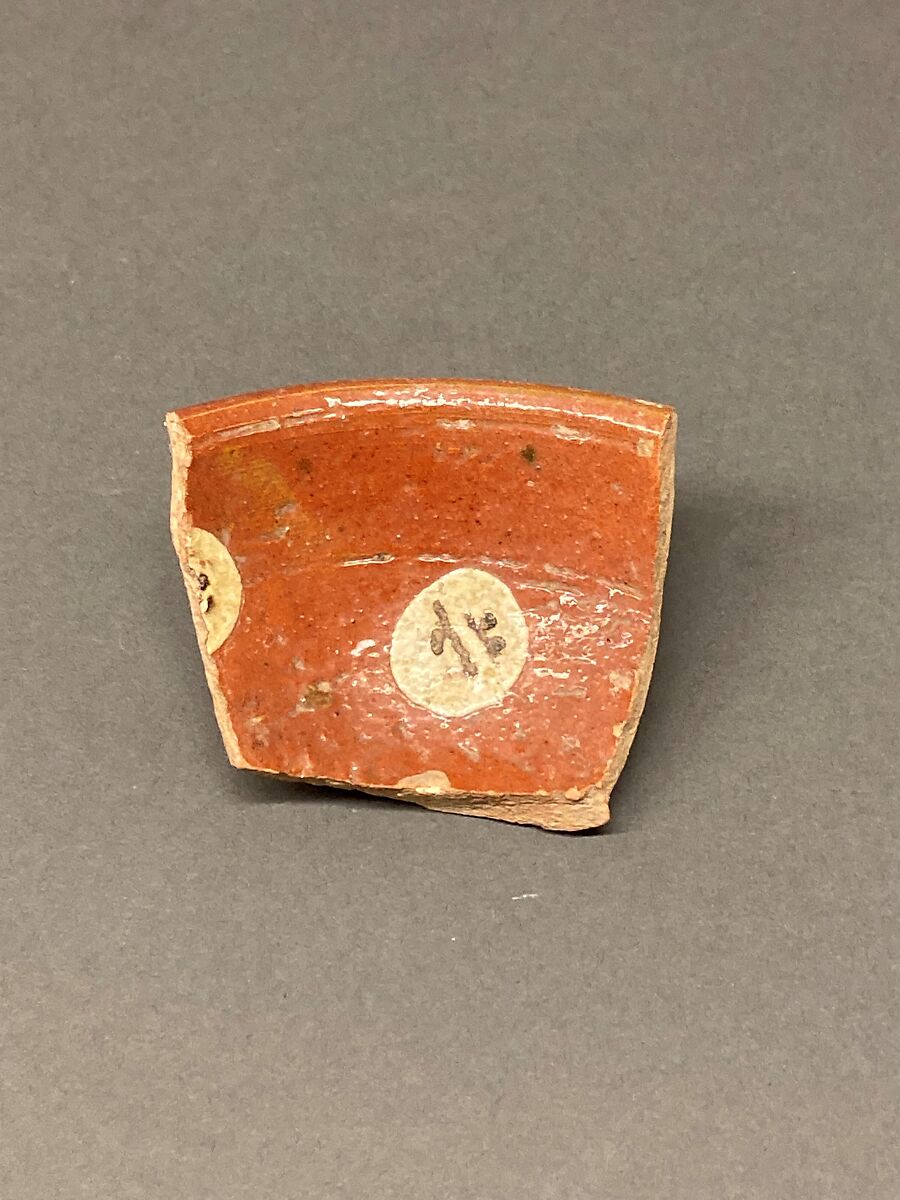 Fragment of a Bowl, Earthenware; reddish body, red slip, white and brown-black slip decoration under glaze 