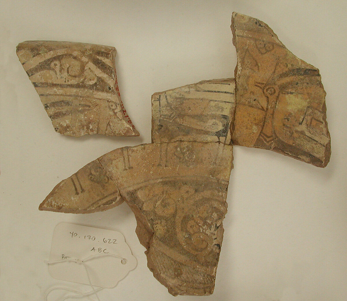 Fragments of a Bowl, Earthenware; buff body, buff slip, underglaze painted in polychrome pigments under transparent glaze